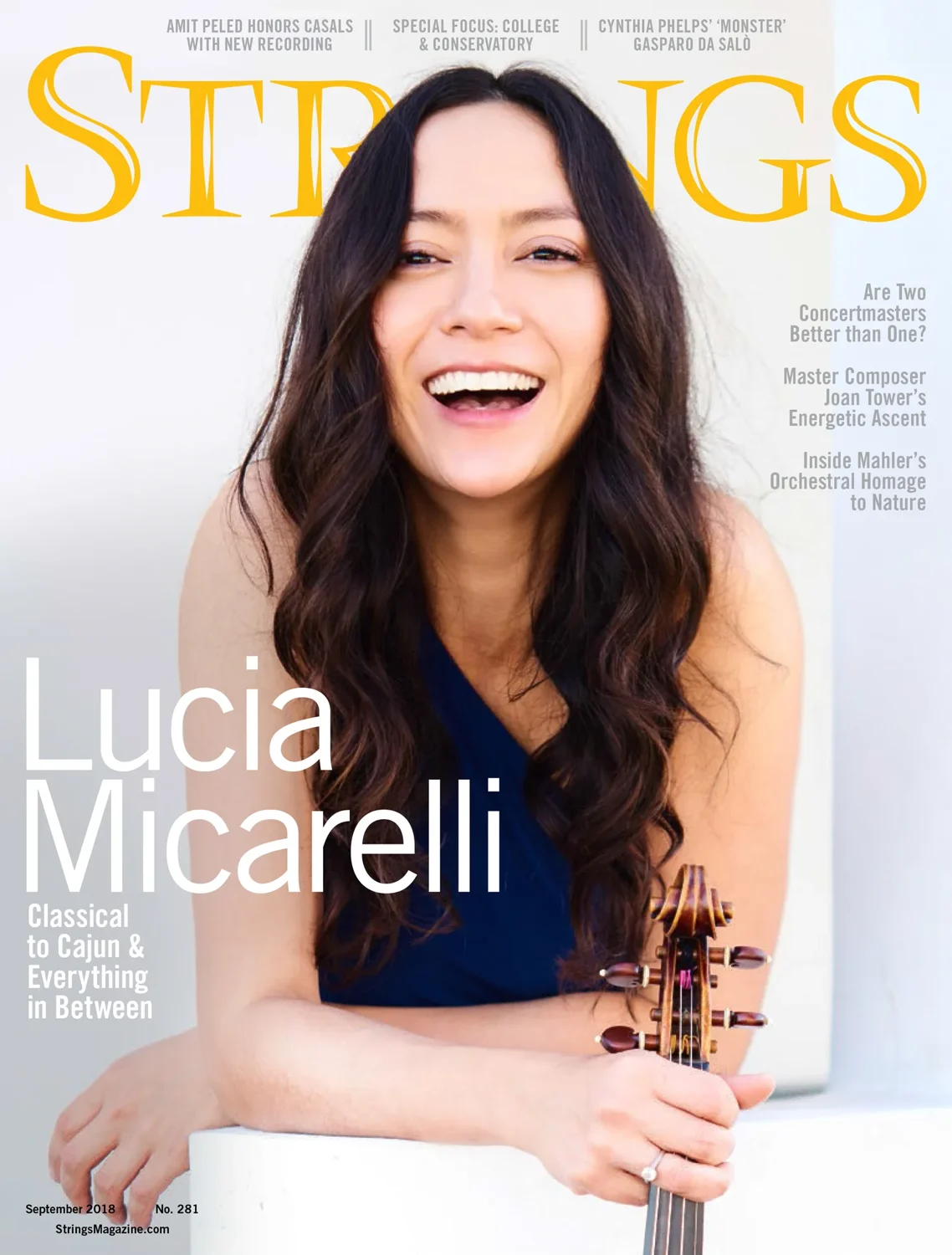 Lucia Micarelli on the cover of Strings magazine, holding her violin